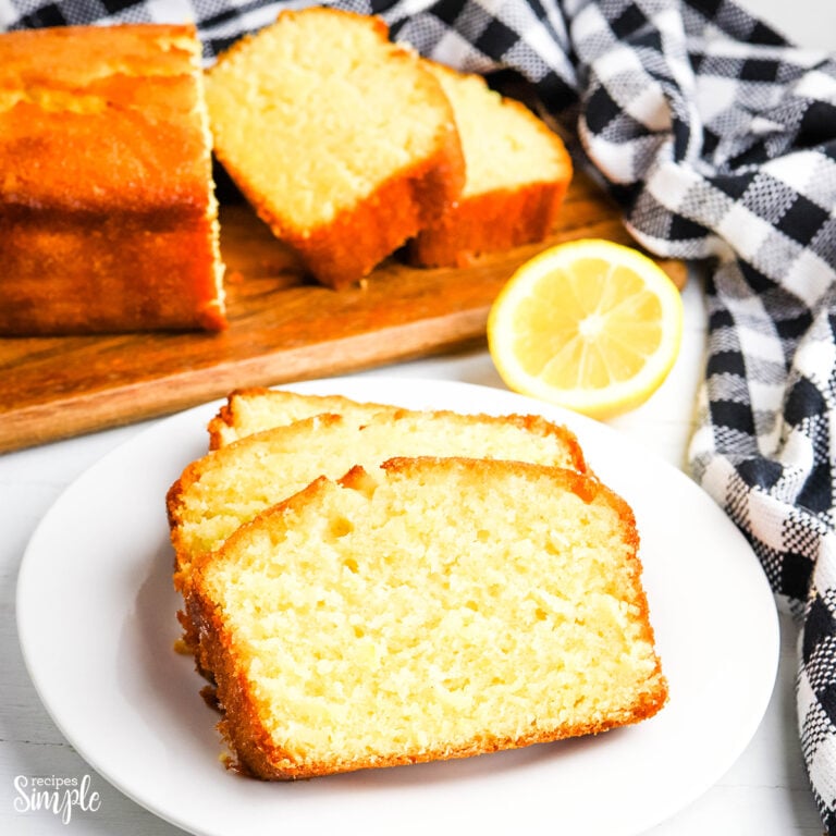 Three slices of lemon pound cake on white plate