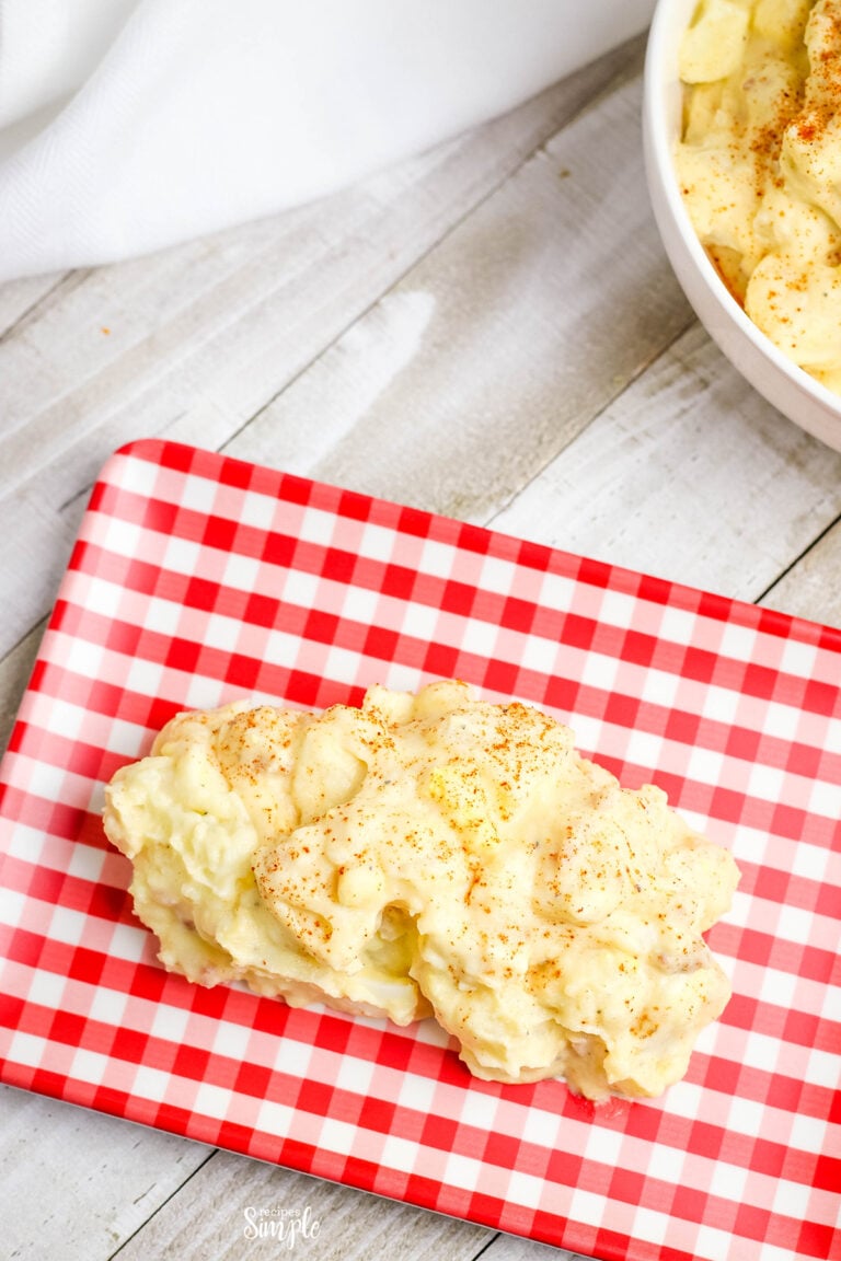 Scoop of Potato Salad on red and white plate