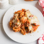 Serving of Italian Pasta Bake on white plate.