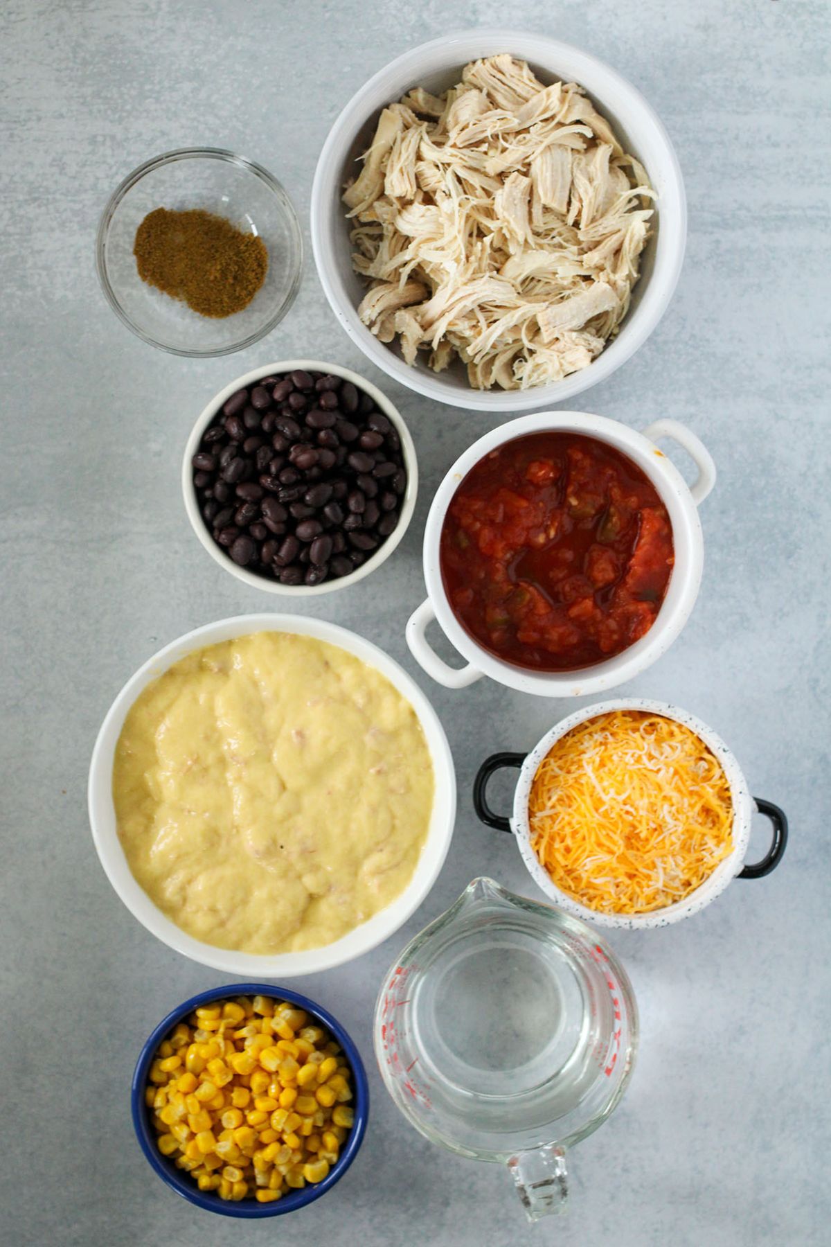Chicken tortilla soup ingredients are set out on the counter.