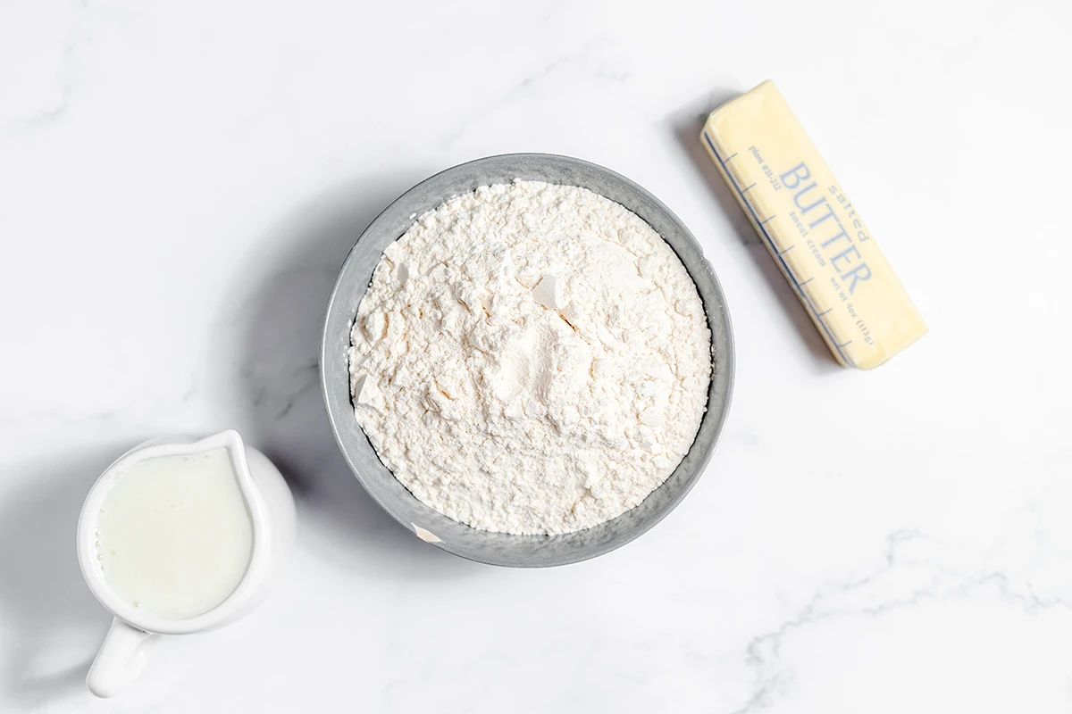 Ingredients for buttermilk biscuits set out on counter.