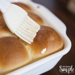 Brushing butter on rolls