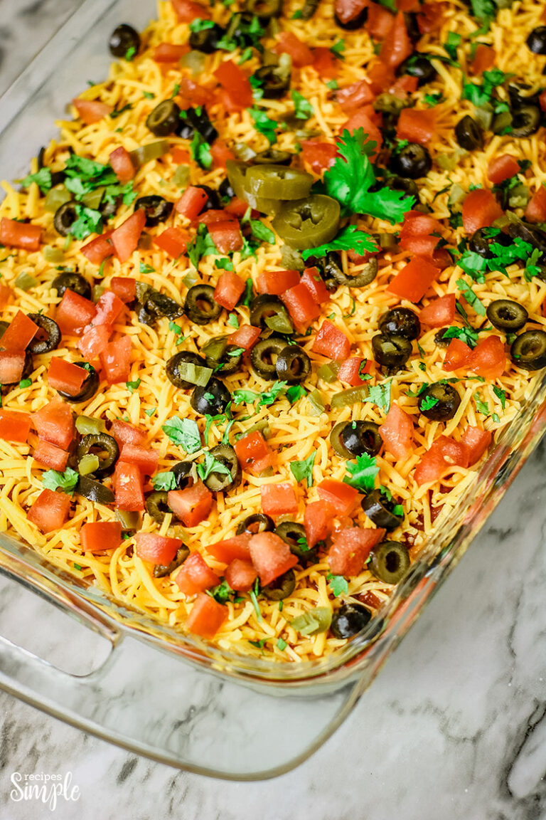 Mexican Layer Dip in glass baking dish on counter