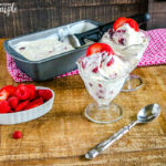 Berry Pie No Churn Ice Cream Scooped in dessert glasses with strawberry on top