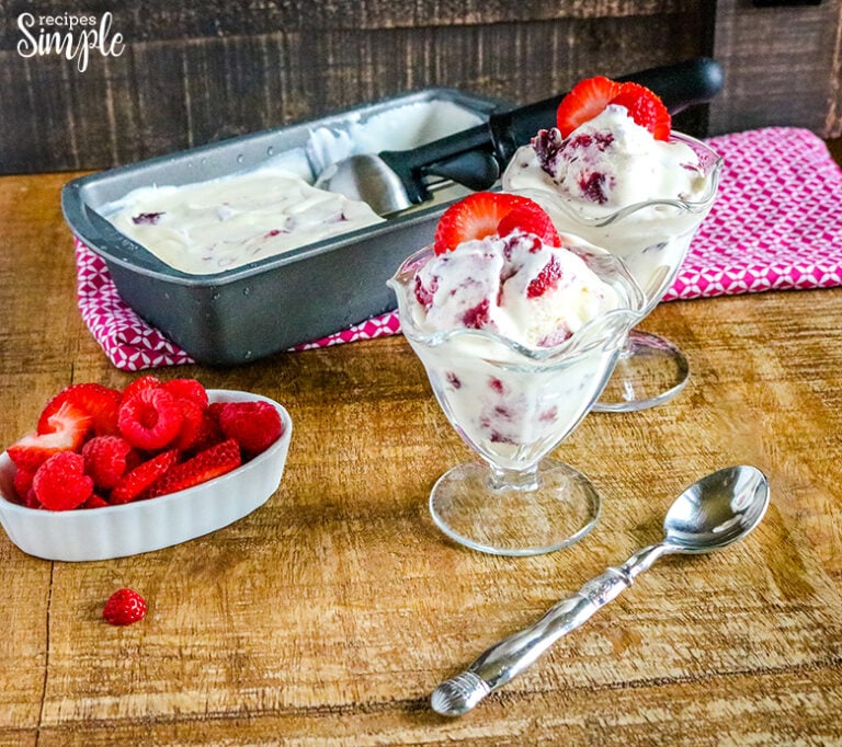 Berry Pie No Churn Ice Cream Scooped in dessert glasses with strawberry on top