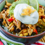 Chicken Burrito Bowl Topped With Guacamole and sour cream
