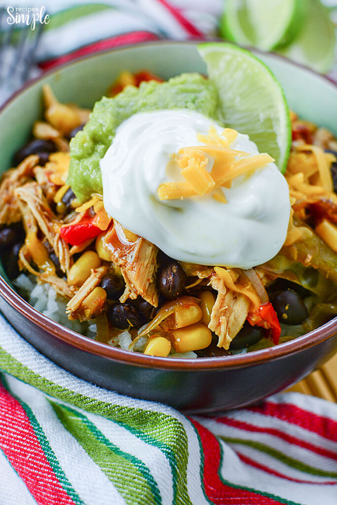 Chicken Burrito Bowl Topped With Guacamole and sour cream