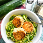 Chicken Meatballs In White Bowl Over Zucchini Noodles