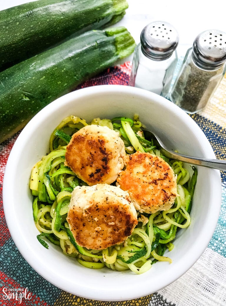 Chicken Meatballs In White Bowl Over Zucchini Noodles