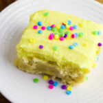 Lemon Cookie Bars topped with sprinkles on white plate