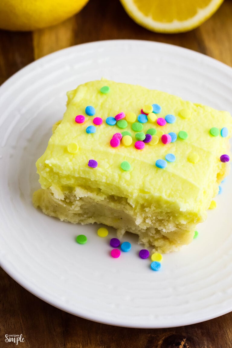 Lemon Cookie Bars topped with sprinkles on white plate