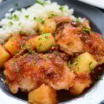 Pineapple Salsa Chicken on blue plate with side of rice