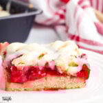 Cherry Pie Bar with Cream Cheese glaze on white plate