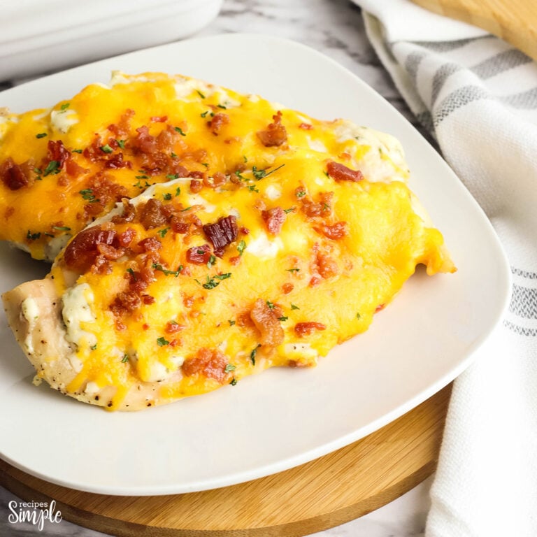 Two Baked Crack Chicken Breasts served on a white plate
