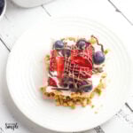 No Bake Berry Cheesecake served on white plate