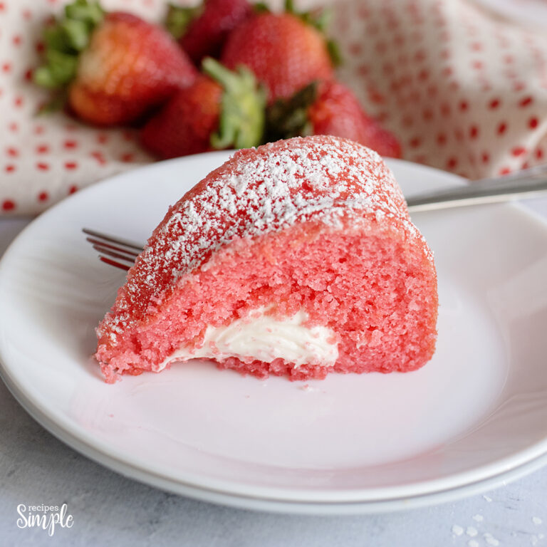 Slice of Strawberry Bundt Cake on white plate