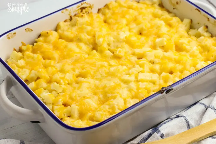 Baked Cheesy Potatoes in white casserole dish