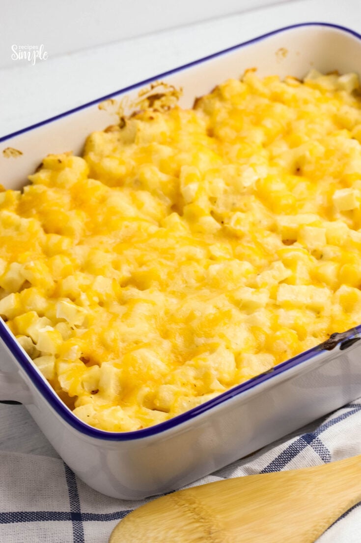 Baked Cheesy Potatoes in white baking dish