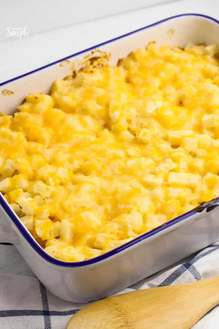 Baked Cheesy Potatoes in white baking dish