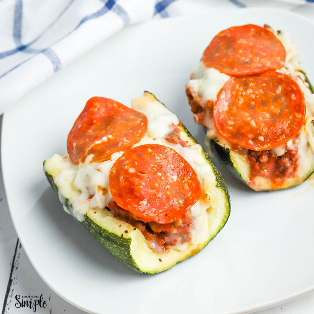 2 Pizza Stuffed Zucchini Boats on white plate