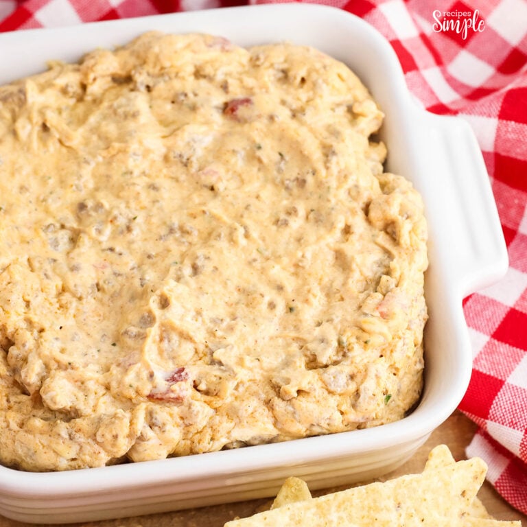 Ranch Taco Dip in white serving dish with side of tortilla chips