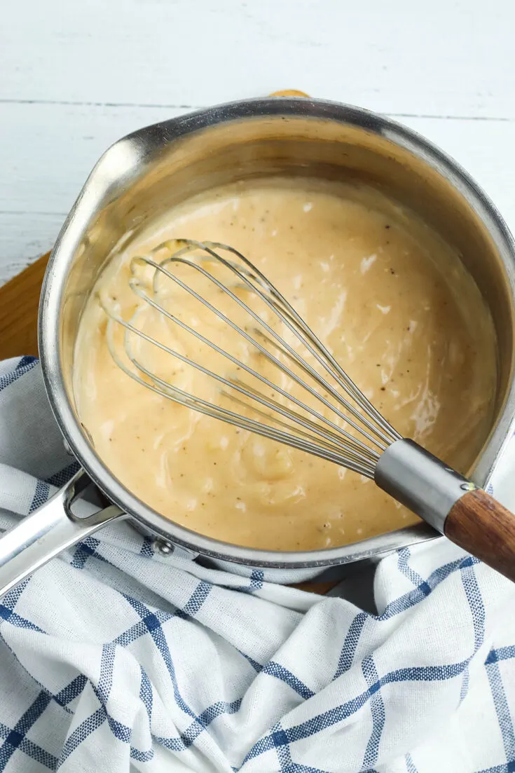 Spices whisked with milk and cornstarch in saucepan