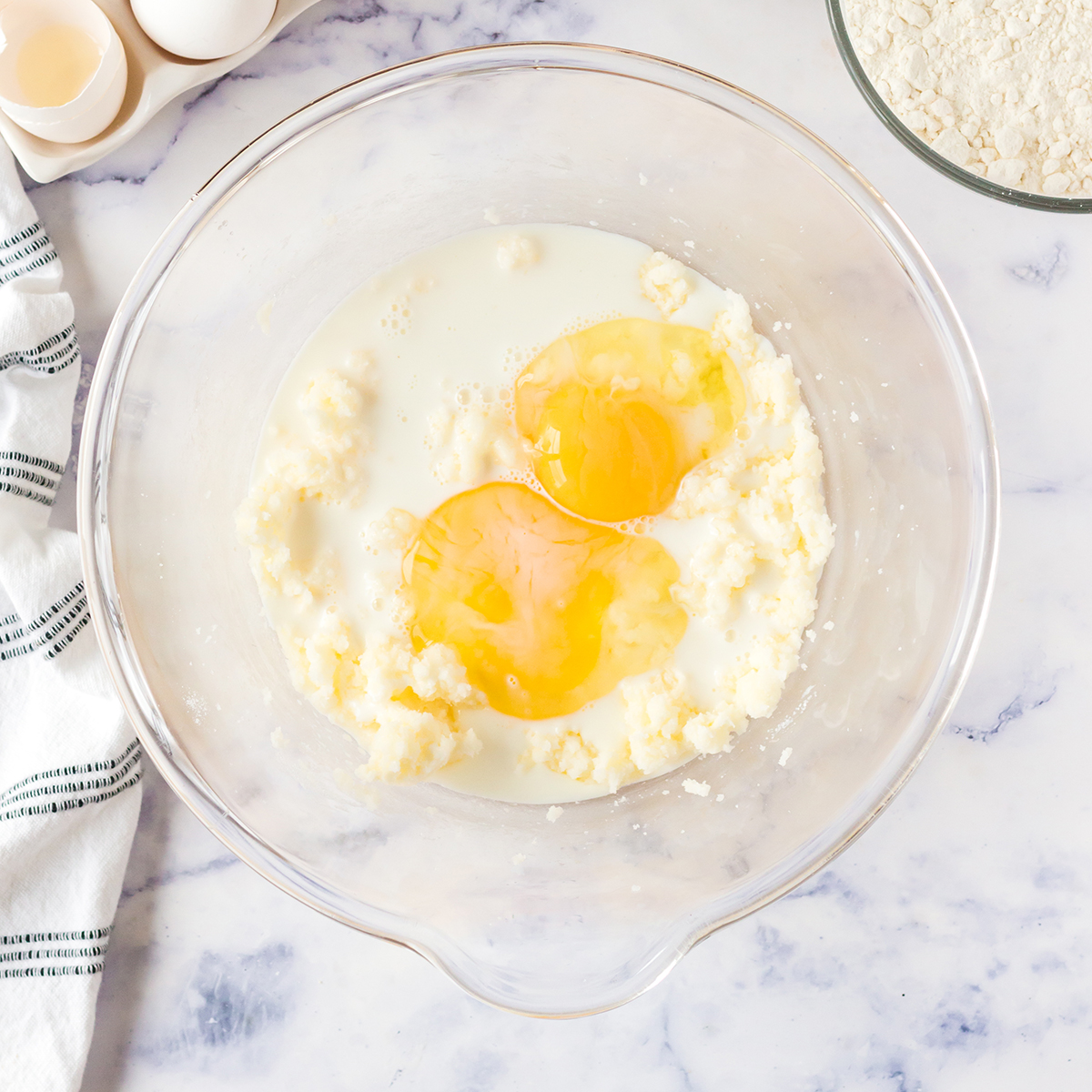 Eggs added to creamed sugar and butter.