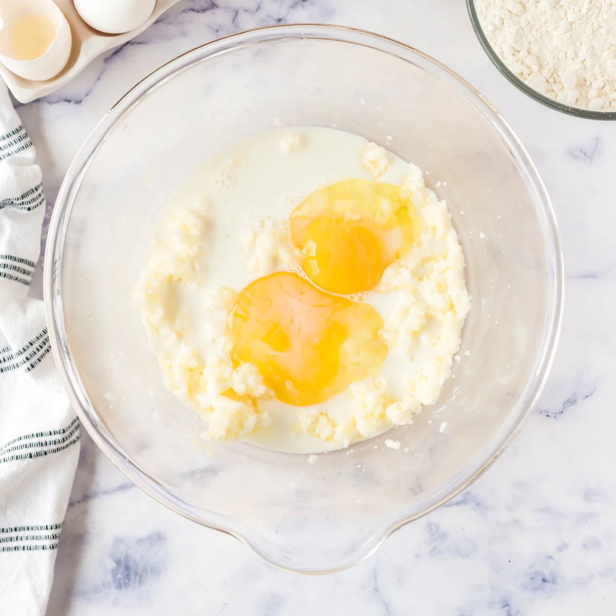 Eggs added to creamed sugar and butter.