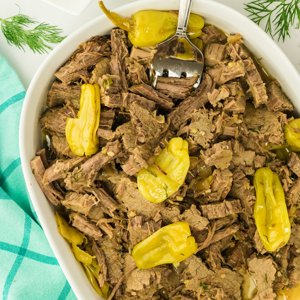 Mississippi Pot Roast served in white casserole.
