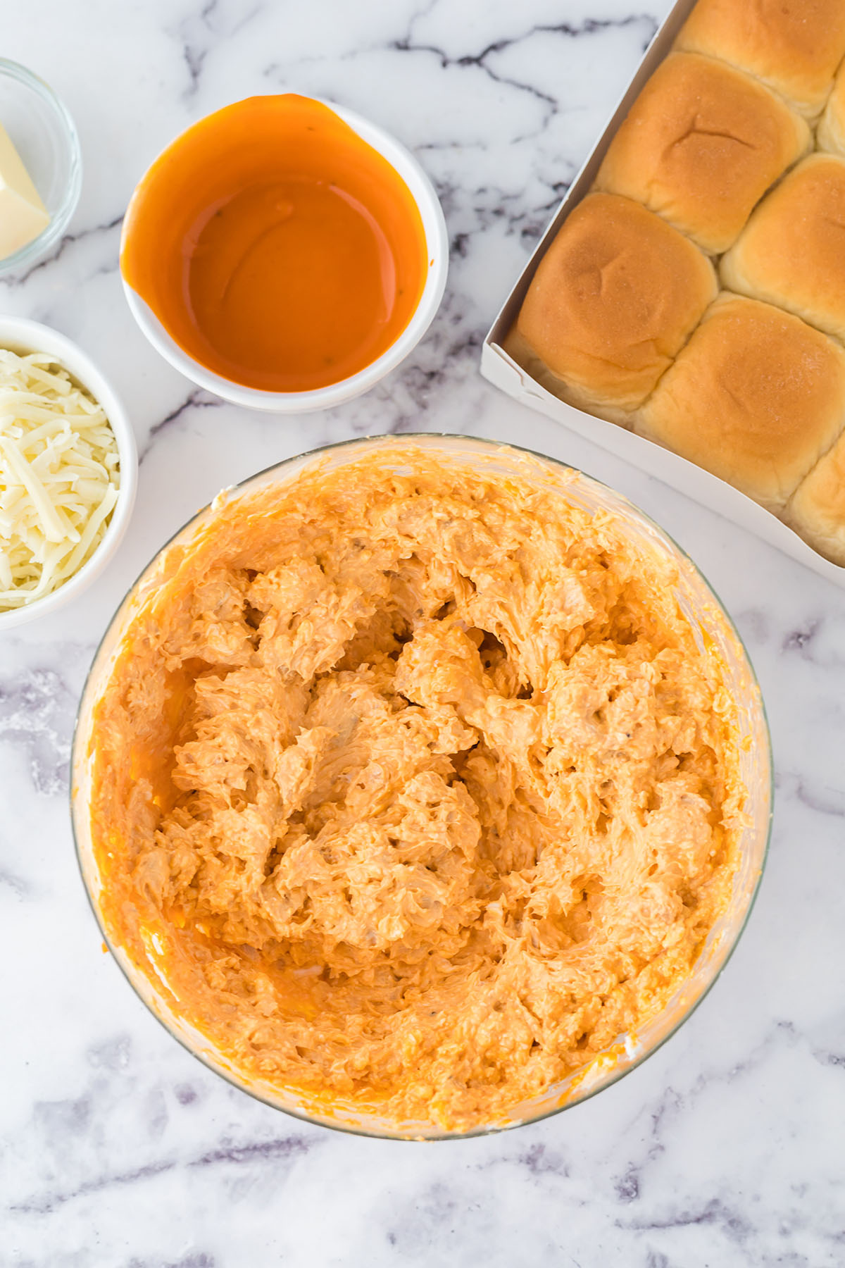 Buffalo Chicken Filling blended in glass mixing bowl.