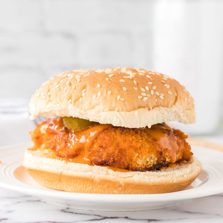 Buffalo Chicken Sandwich on round white plate.