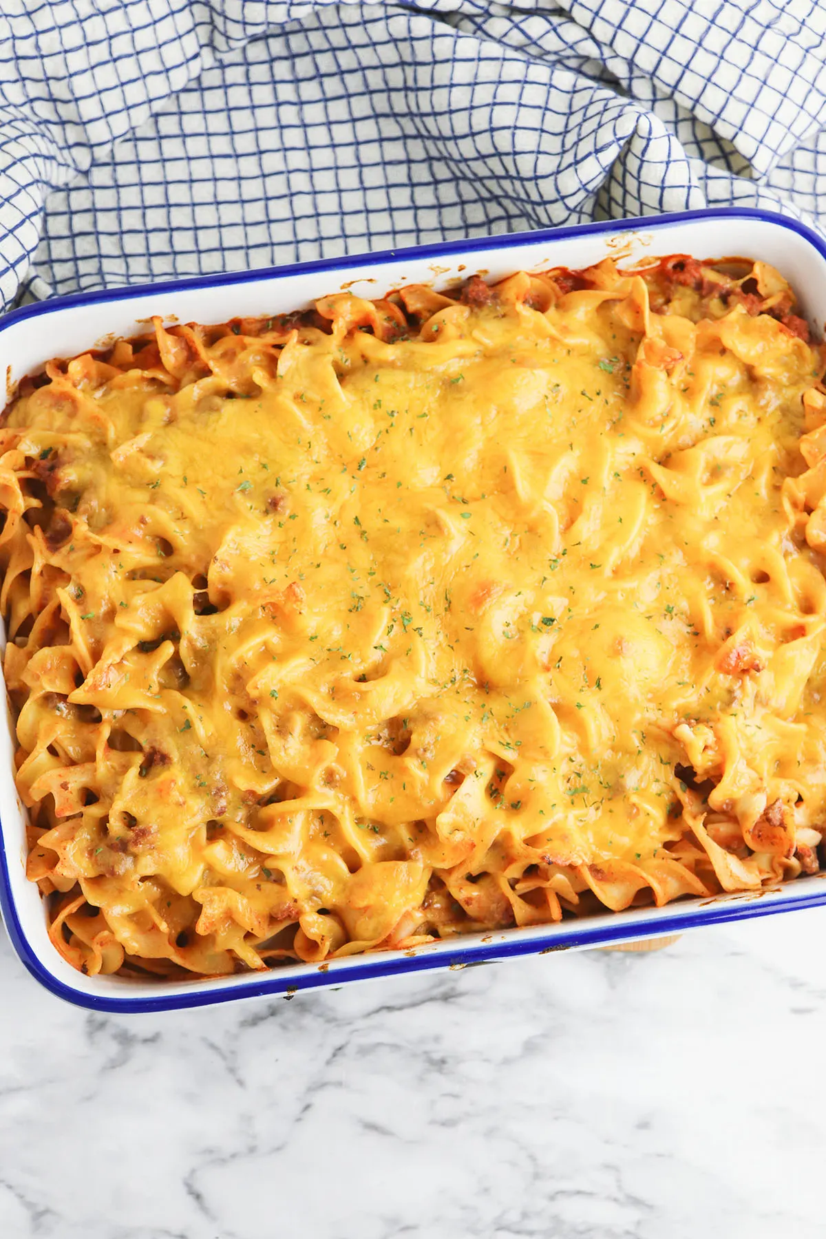 Baked Beef Noodle Casserole cooling in casserole dish.
