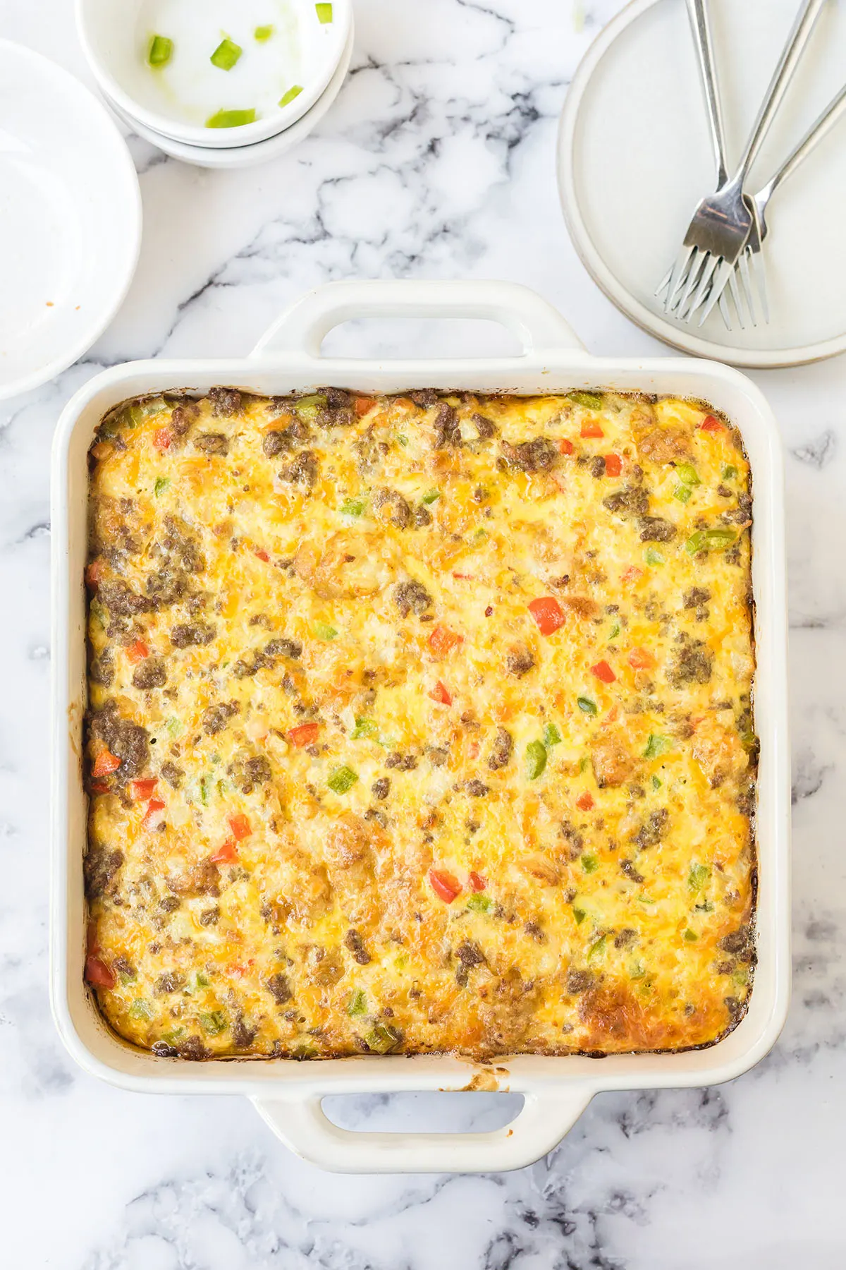 Baked breakfast casserole in baking dish ready to serve.