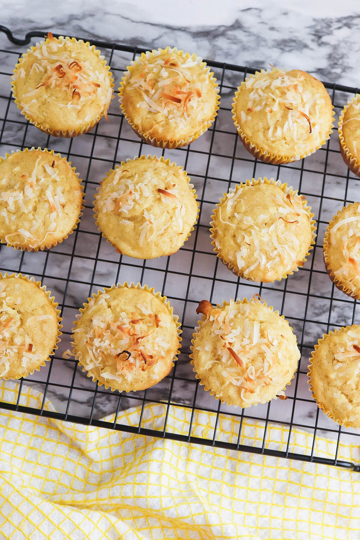 Baked muffins cooling on wire rack.