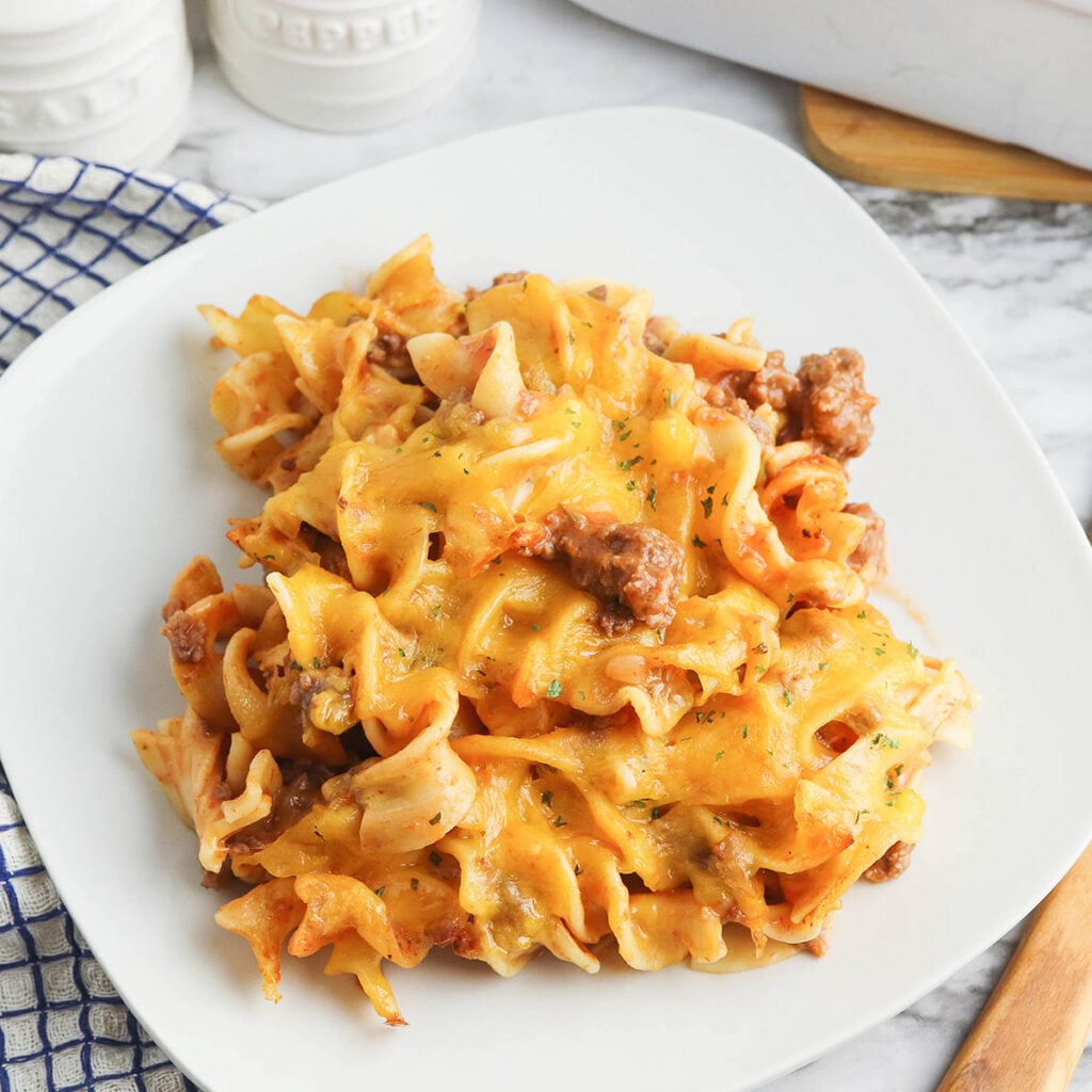 Serving of Beef Noodle Casserole on white plate.