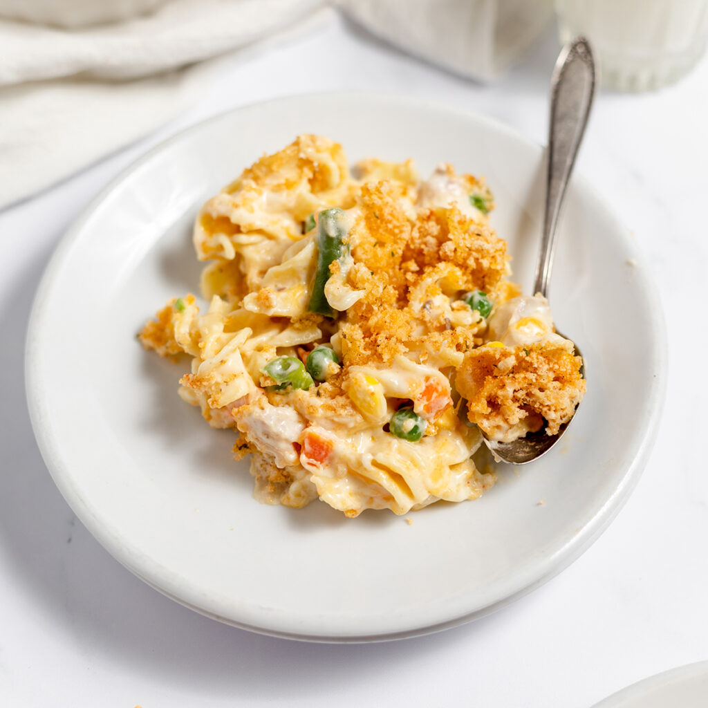 Serving of Chicken Noodle Casserole on white plate.