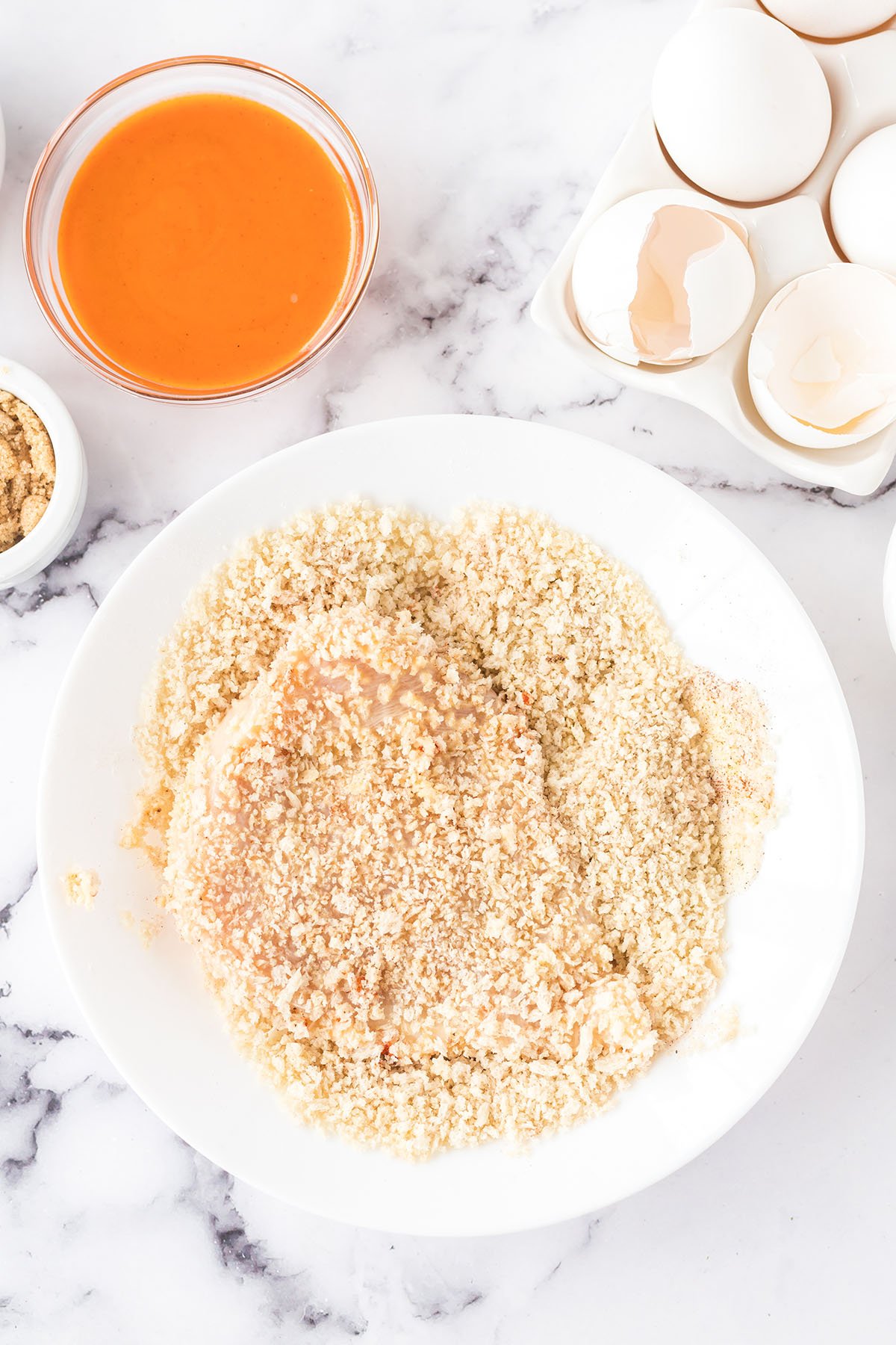Chicken coated in panko crumbs mixture.