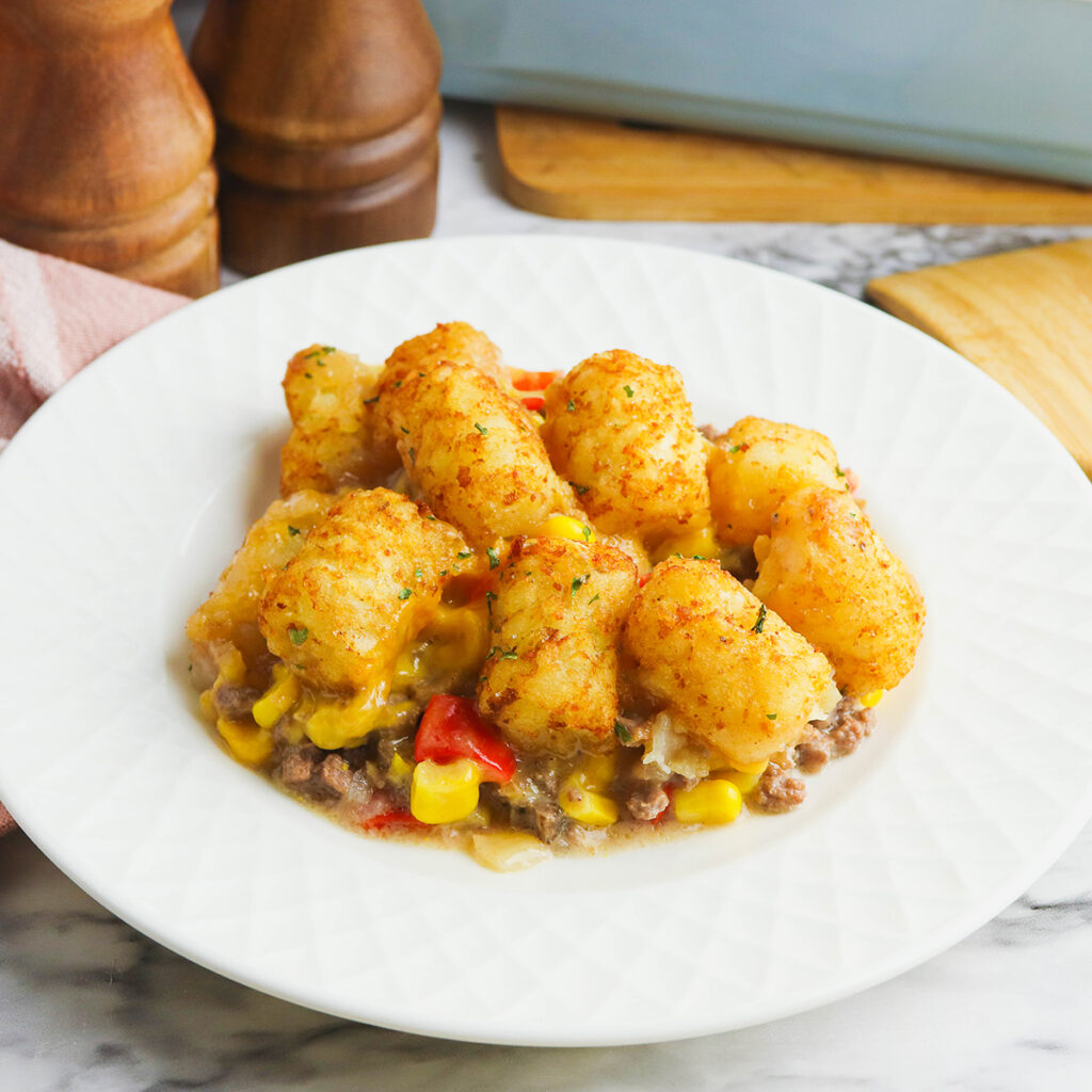 Serving of Tater Tot Casserole on white plate.