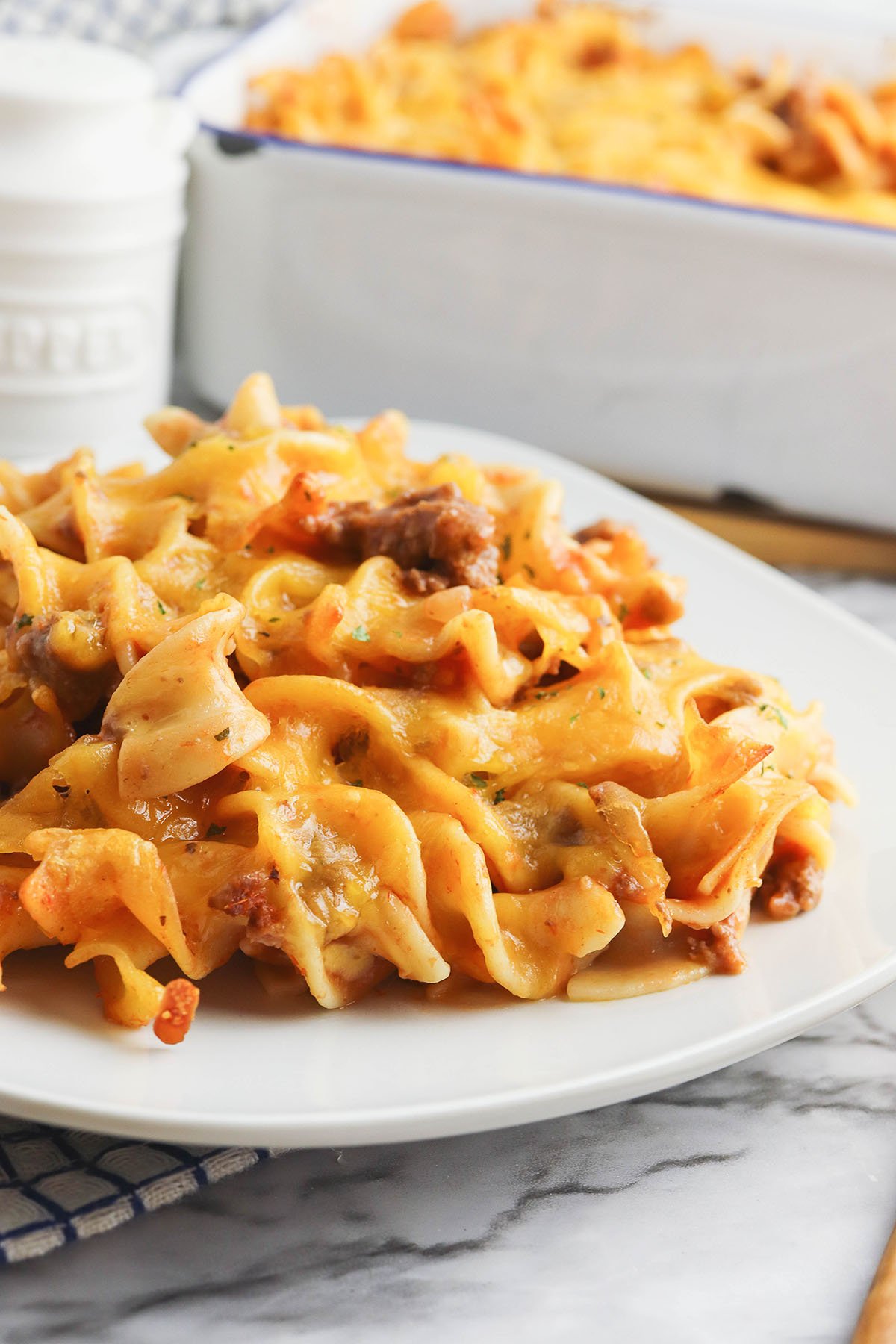 Serving of Beef Noodle Casserole on white plate.