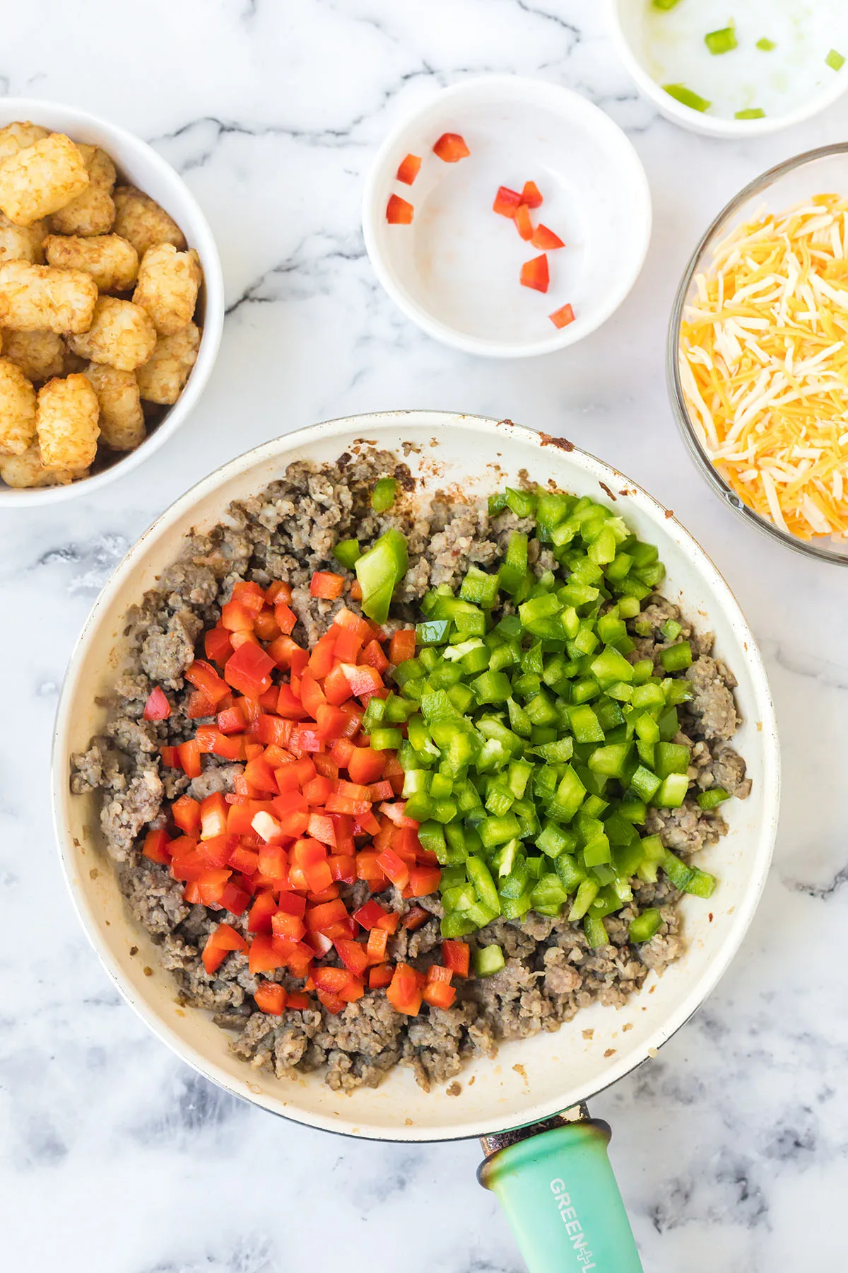 Sausage and bell peppers in skillet.
