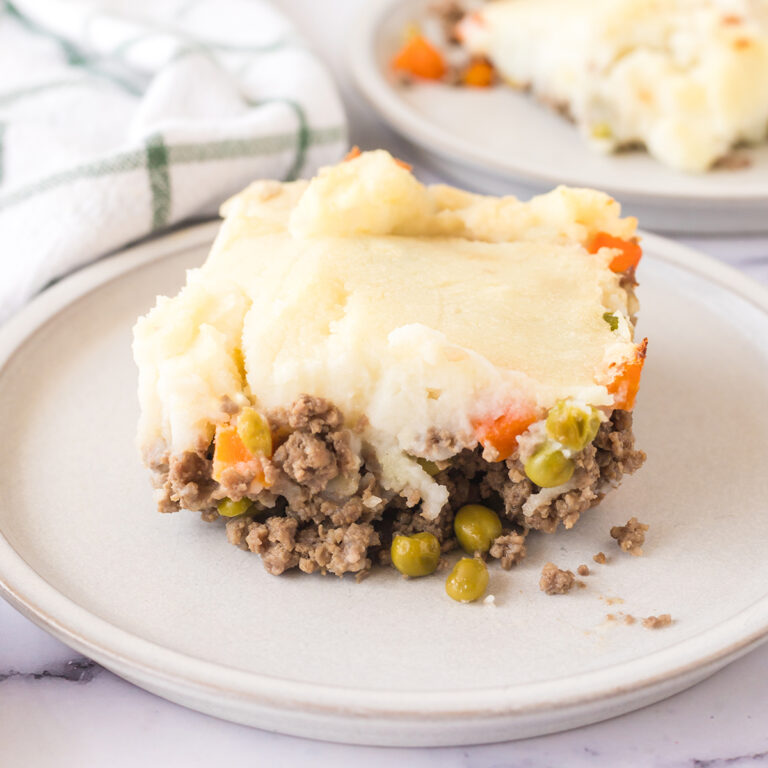 A serving of Shepherd's Pie on white plate.