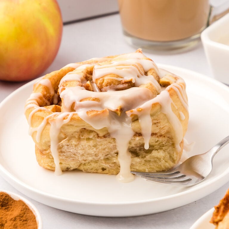 Apple Cinnamon Roll on white plate.