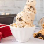 Scoops of Peanut Butter Chocolate Chip Ice Cream in white bowl.