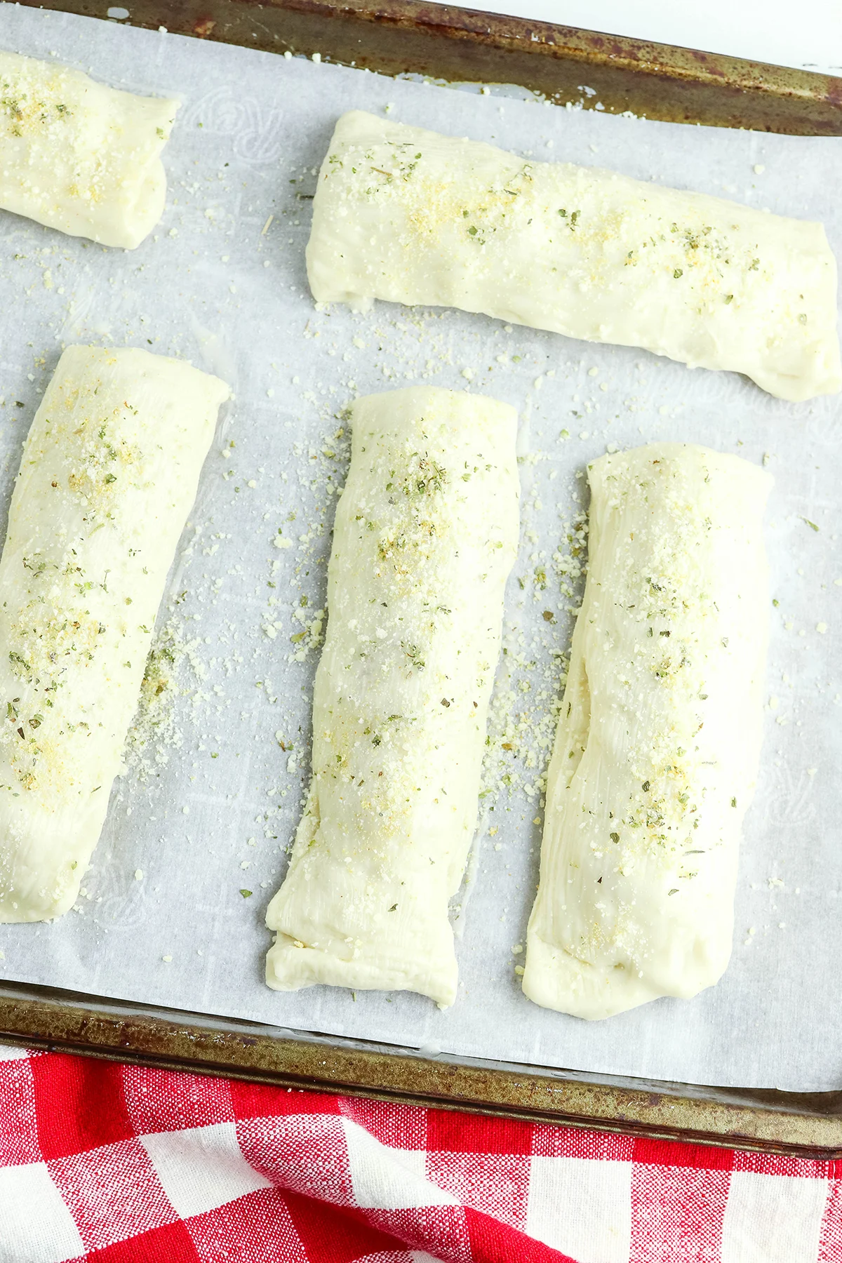 Pepperoni Breadsticks on baking sheet lined with parchment paper.
