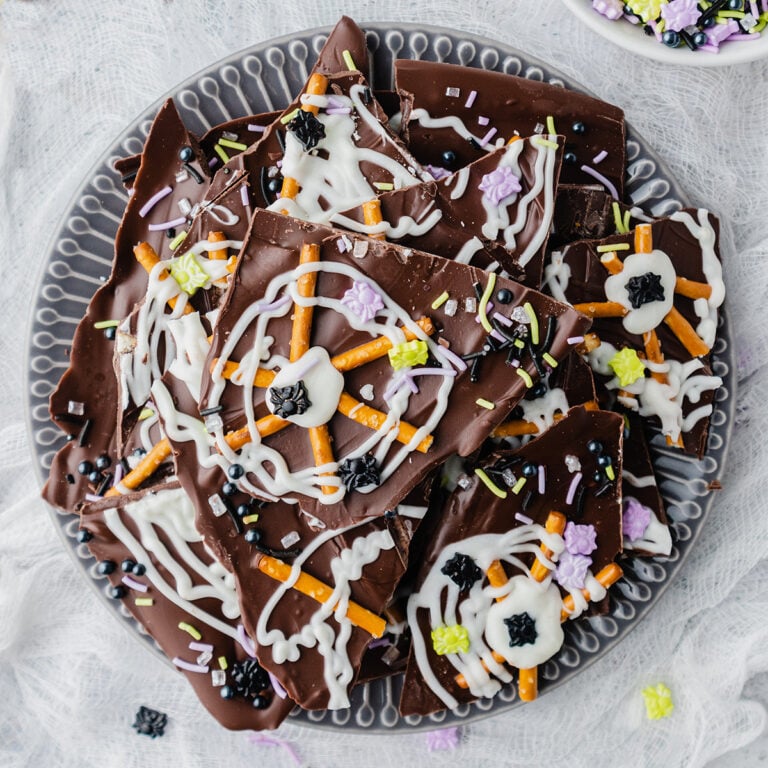 Spider Web Chocolate Bark pieces on platter.