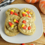 Candy Corn Cookies stacked on white plate.
