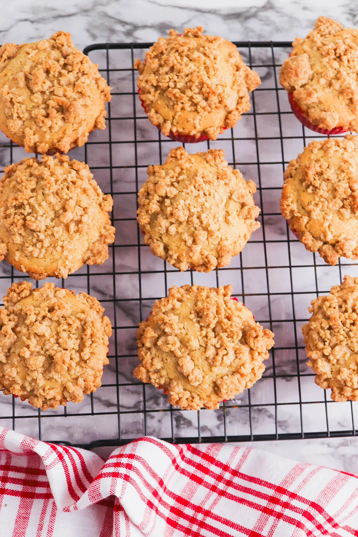 Baked Cranberry Sauce Muffins cooling on a wire rack.