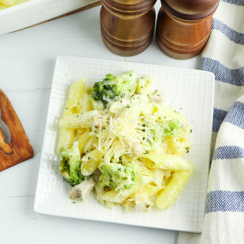 A serving of chicken alfredo casserole on a white plate.
