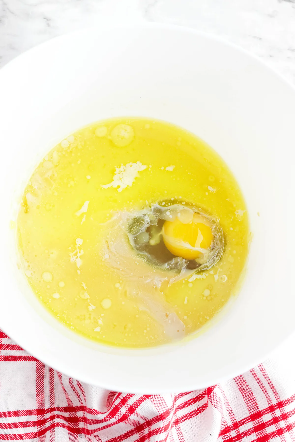 Milk, brown sugar, butter, egg, and vanilla in a mixing bowl.
