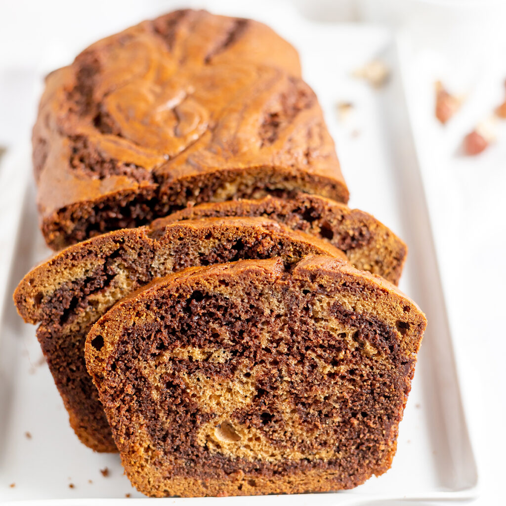 Nutella Banana Bread on a white serving platter.